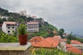 POT With flowers in the city of Kruja, Albania. June 2018. View of the fortress Royalty Free Stock Photo