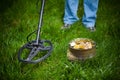 Pot of golden coins collected with metal detector