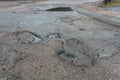 Pot holes with water in road Royalty Free Stock Photo