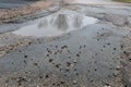 Pot holes with water in road Royalty Free Stock Photo