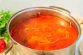 Pot with a homemade appetizing and tasty borsch. Red beetroot vegetable soup, boiling in a saucepan. Ukrainian and russian Royalty Free Stock Photo