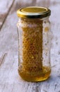 Pot of honey with honeycomb Royalty Free Stock Photo