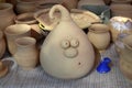 The pot is made of clay in the form of the head of the character anime. The pot is a moneybox.