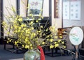 A pot of primroses in a Chinese teahouse.