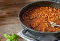 Pot with ragout on wooden background with sopy space Royalty Free Stock Photo
