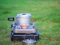 Pot stands on a portable gas stove. cooking on camping concept.