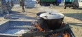 pot of water is heated on fire for Ukrainian soldiers. Hot coffee at war