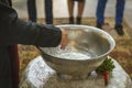 A pot of water in which the child to be baptized is immersed. Royalty Free Stock Photo