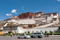 Potala palace with cars in Lhasa, Tibet