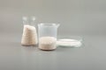 Potassium sorbate, granular potassium salt of sorbic acid in laboratory flasks and Petri dish. Food additive E202 used in variety