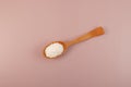 Potassium sorbate in wooden spoon. Food preservative E202 or potassium salt of sorbic acid added effective in a variety of