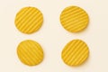 Slices of crinkle-cut potato chips are arranged in a pile. Royalty Free Stock Photo