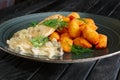 Potato balls with chicken fillet and mushroom and onion sauce Royalty Free Stock Photo