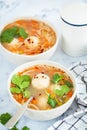 Potato balls soup with noodles and vegetables in white bowl, white background. Vegan food concept Royalty Free Stock Photo