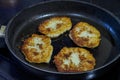 Potato cakes fried in a frying pan in sunflower oil Royalty Free Stock Photo