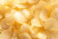 Potato chips background in the sunlight. Royalty Free Stock Photo