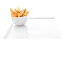 Potato chips in a bowl over white background Royalty Free Stock Photo