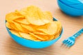 Potato chips in bowl on table Royalty Free Stock Photo