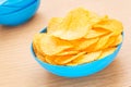 Potato chips in bowl on table Royalty Free Stock Photo