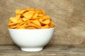 Potato chips bowl on a wooden background Royalty Free Stock Photo