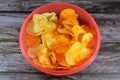 Potato chips, crisps, thin slices of potato, deep fried, baked, or air fried until crunchy, served as a snack, side dish, or Royalty Free Stock Photo