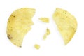 Potato chips with crumbs and leftovers isolated on white background, top view. Cracked potato chips isolated on white Royalty Free Stock Photo