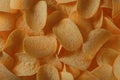 Potato chips in direct sunlight for background Royalty Free Stock Photo