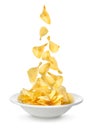 Potato chips falling in the plate Royalty Free Stock Photo