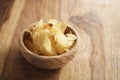 Potato chips with herbs in wood bowl Royalty Free Stock Photo