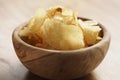 Potato chips with herbs in wood bowl Royalty Free Stock Photo