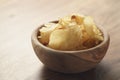 Potato chips with herbs in wood bowl Royalty Free Stock Photo