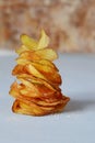 Natural potato chips with sea salt on a light background. Diet. Royalty Free Stock Photo