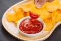 Potato chips and ketchup. Beer snack, unhealthy eating