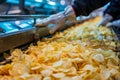 Potato Chips Production Line, Food Industry, Working on Automated Production Lines in Potato Chips Factory Royalty Free Stock Photo