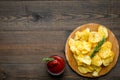 Potato chips served wiith ketchup on wooden background top view mock up Royalty Free Stock Photo