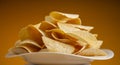 Potato chips on white plate close-up Royalty Free Stock Photo