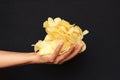 Potato chips on woman palm stock photo Royalty Free Stock Photo