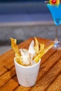 Potato chips on wood table Royalty Free Stock Photo