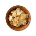 Potato chips on a wooden bowl isolated over white background Royalty Free Stock Photo