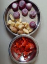 Potato Cutting and Onion.Potato cuttings and onions in the steel dish and tomato cuttings on the side.