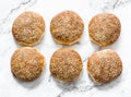 Potato dough burger buns on a light background, top view Royalty Free Stock Photo