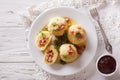 Potato dumplings stuffed with ham, bacon and onion close-up. horizontal top view