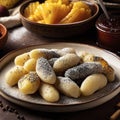 Potato dumplings sulance gnocci with milled poppy seeds shugar powder and marmalade