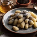 Potato dumplings sulance gnocci with milled poppy seeds shugar powder and marmalade