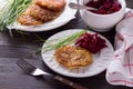 Potato fritters with red onion and spices, beet salad Royalty Free Stock Photo