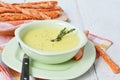 Potato and garlic cream soup with bread sticks Royalty Free Stock Photo