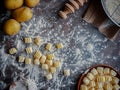 Potato gnocchi being prepared on a table dusted with flour