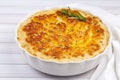 Potato gratin - graten baked potatoes with cream and cheese with rosemary and forks Turkish name; Kremali patates