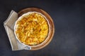 Potato gratin - graten (baked potatoes with cream and cheese) with rosemary and forks (Turkish name Kremali patates