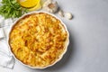 Potato gratin - graten (baked potatoes with cream and cheese) with rosemary and forks (Turkish name Kremali patates